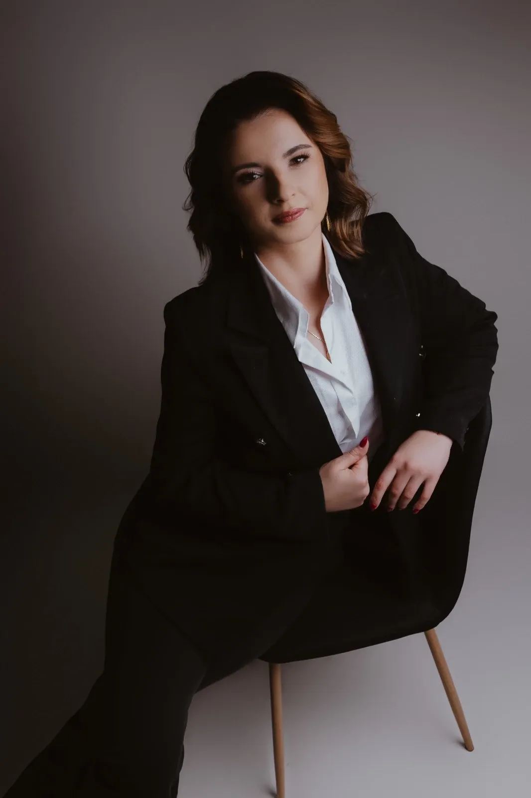 owner posing on a chair